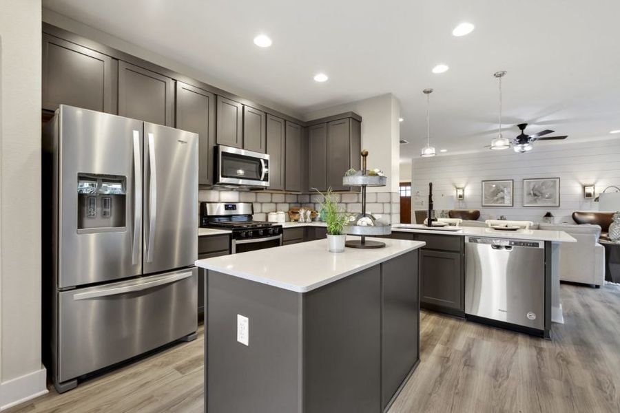 Representative furnished interior of a home built from the Houston by Pacesetter Homes in Village At Manor Commons, Manor (Image 9).
