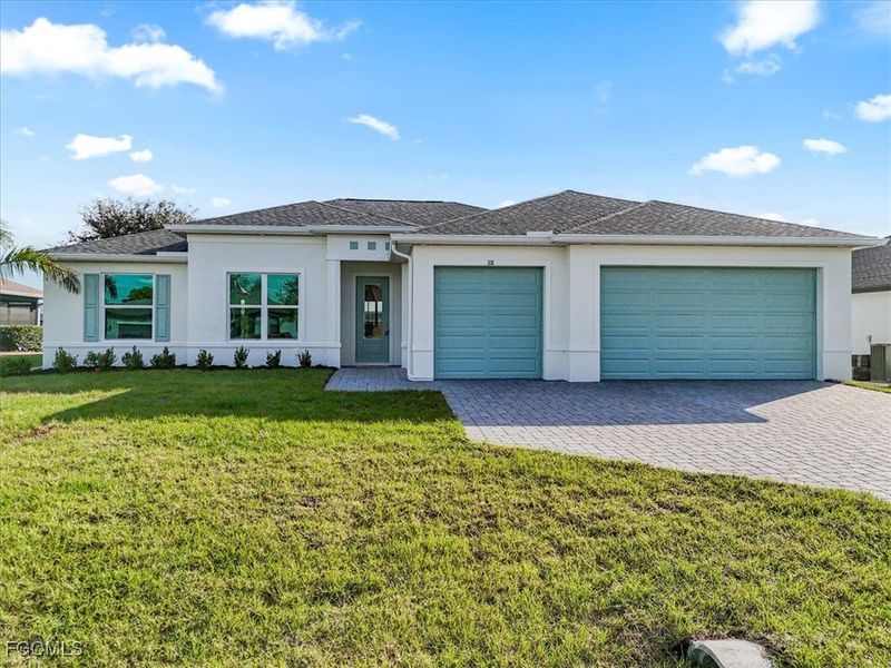 Front exterior of a new home in Cape Coral, Cape Coral, FL, highlighting curb appeal (Image 1).