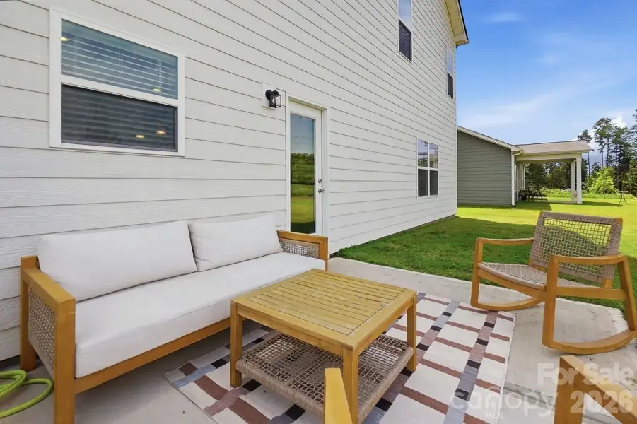 Exterior details and patio area of a home in Pine Bluff, Midland (Image 25).