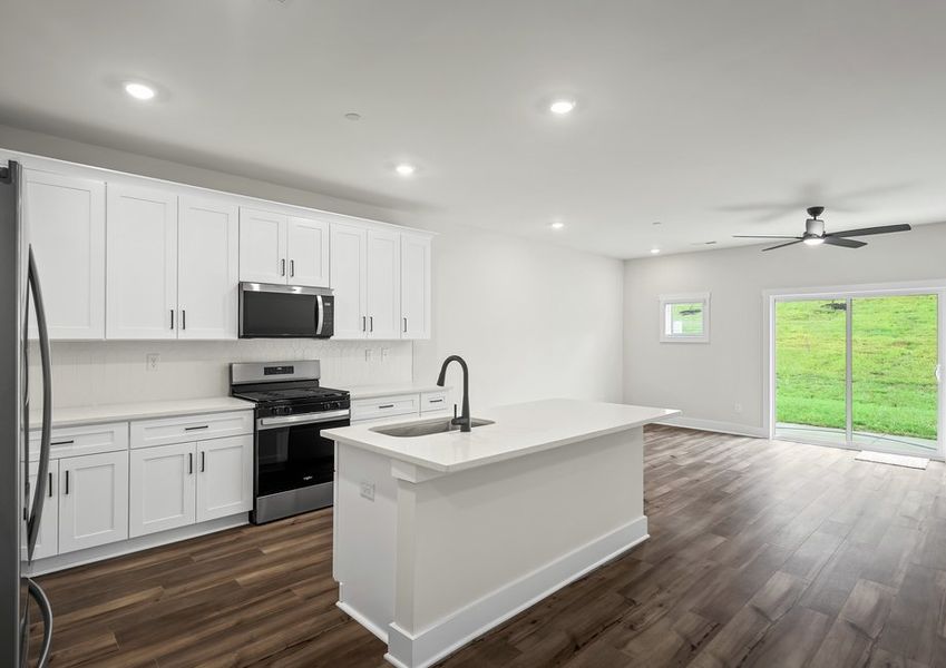 Set up a few bar stools and enjoy breakfast on the island