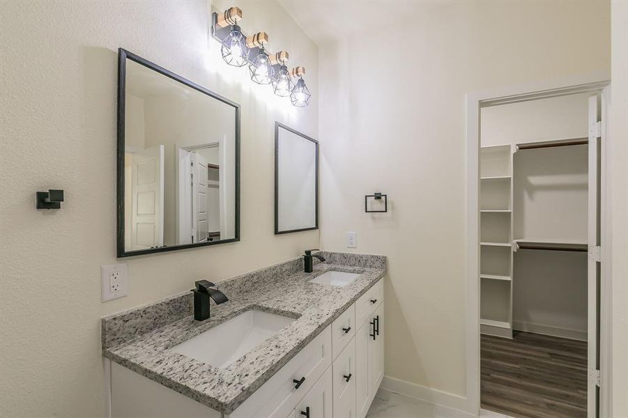 Bathroom featuring hardwood / wood-style floors and vanity