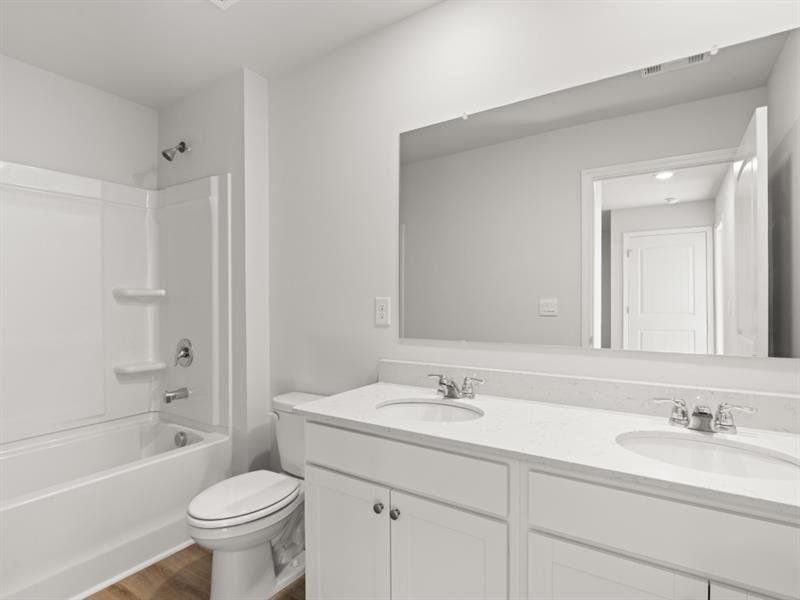 Furnished interior view inside a new home in Waypoint, Flowery Branch (Image 11).