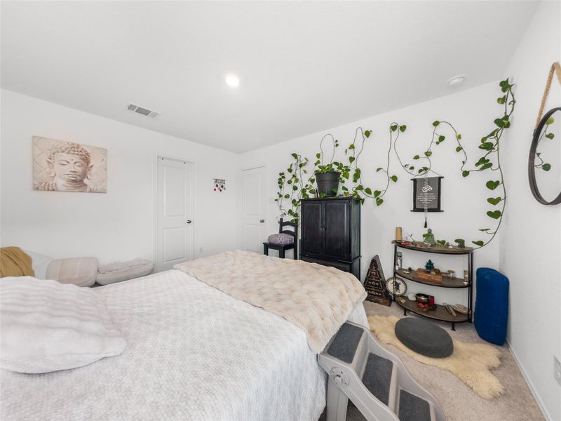 Bedroom with carpet floors and baseboards
