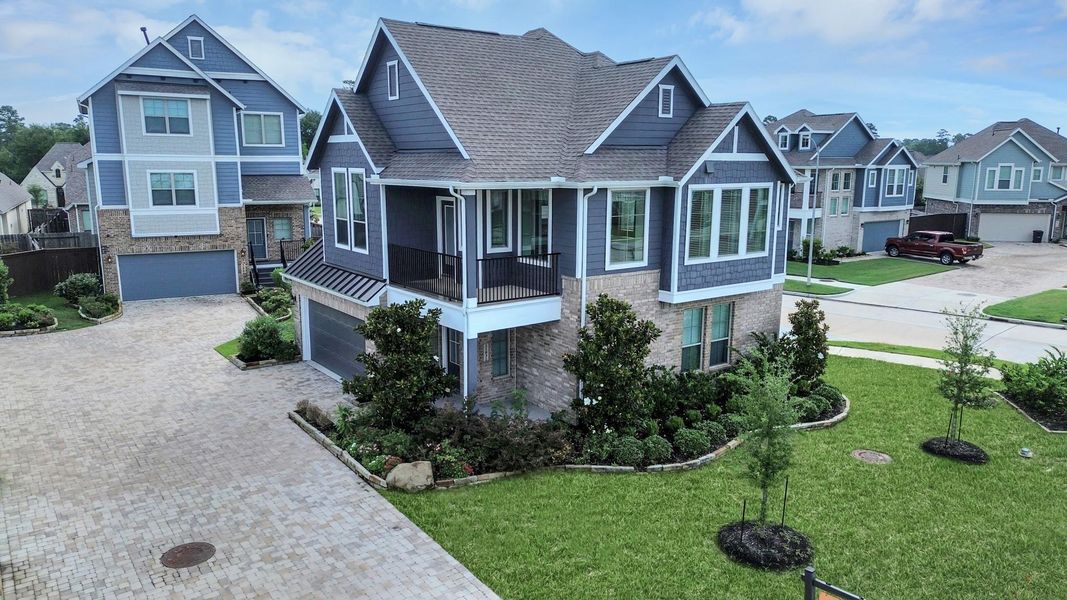 Front exterior of a new home in The Groves, Humble, TX, highlighting curb appeal (Image 28).