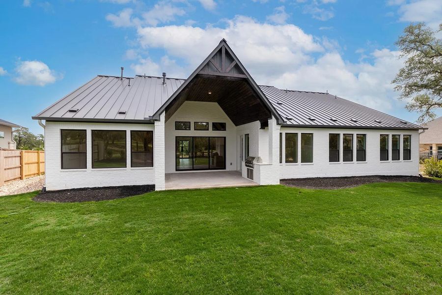 Front exterior of a new home in Caliterra - 110', Dripping Springs, TX, highlighting curb appeal (Image 1). Front exterior of a new home in Caliterra - 110', Dripping Springs, TX, highlighting curb appeal (Image 1).