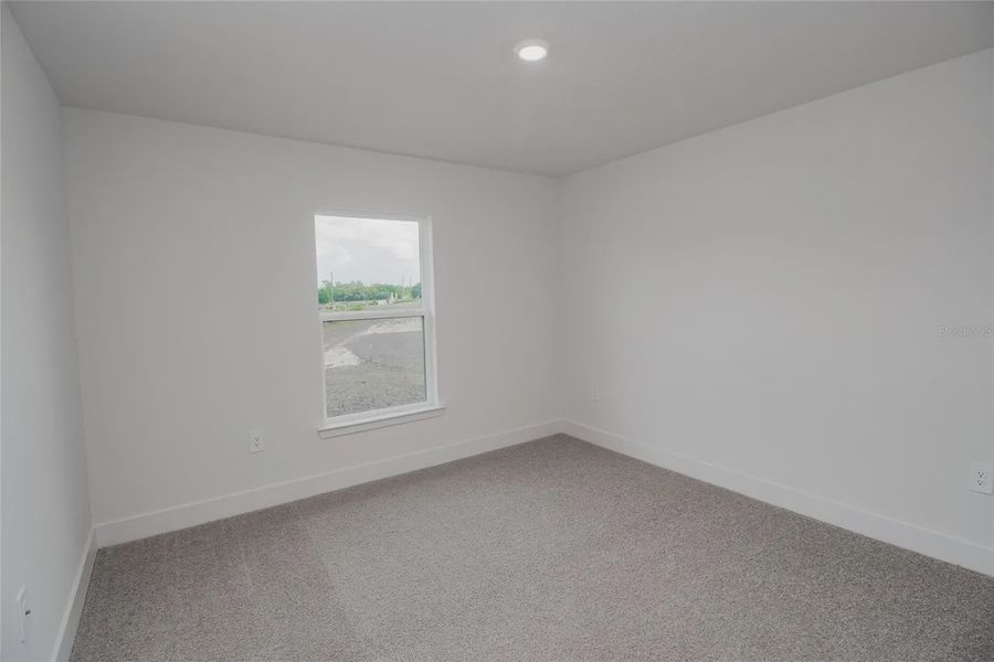 Spacious, unfurnished interior of a new home in Hickory Ridge Estates, Lake Wales (Image 26).