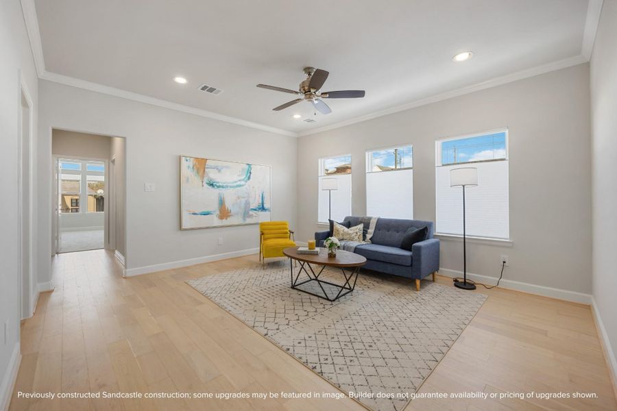 The second-story game room, a realm of leisure nestled between the serenity of the primary suite and the charm of a secondary bedroom, brightened by an expansive wall of windows. The second-story game room, a realm of leisure nestled between the serenity of the primary suite and the charm of a secondary bedroom, brightened by an expansive wall of windows.