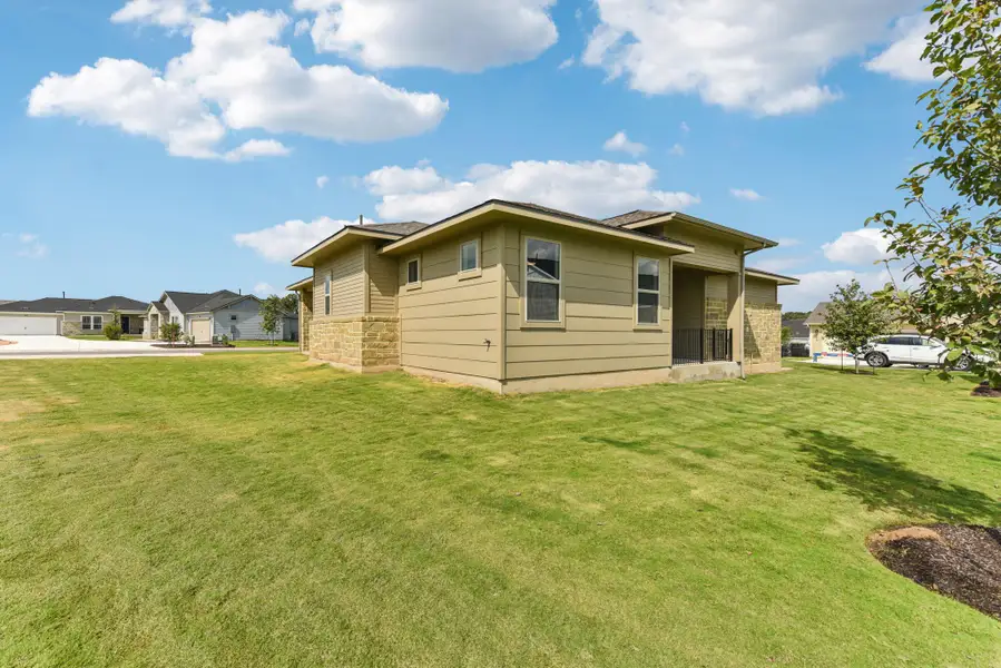 View of home's exterior with a yard
