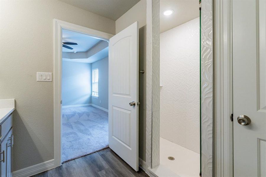 Primary bathroom; beautiful walk in tiled shower