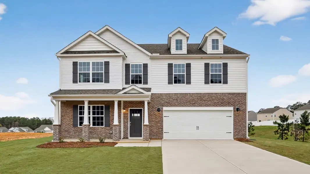 Front exterior of a new home in North Gate, Vass, NC, highlighting curb appeal (Image 2). Front exterior of a new home in North Gate, Vass, NC, highlighting curb appeal (Image 2).