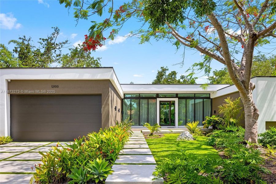 Front exterior of a new home in , Pinecrest, FL, highlighting curb appeal (Image 24).