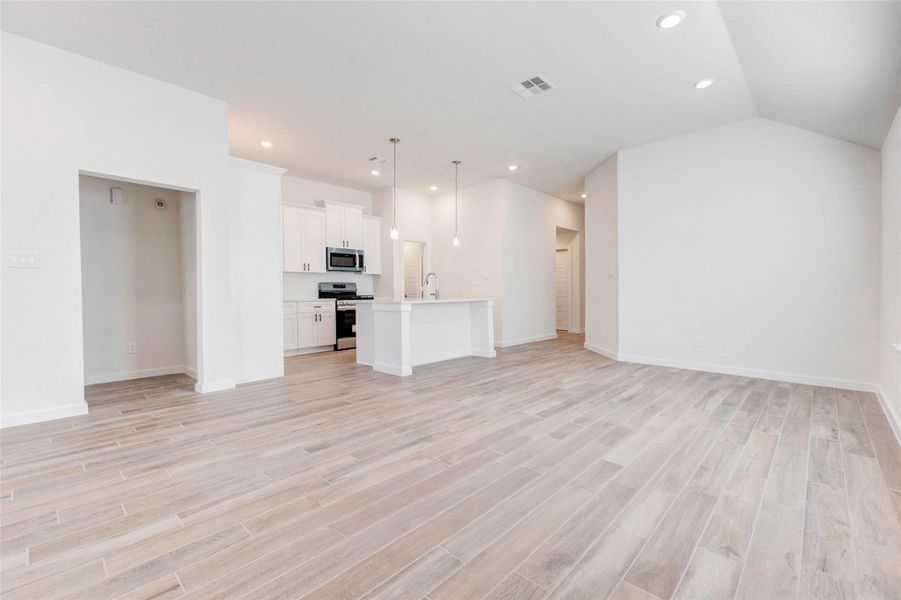 Enjoy ultimate versatility in this expansive living area with sightlines to the kitchen, island, and multiple access points. Whether you're watching a movie or entertaining a crowd, the space adapts effortlessly to any lifestyle with style and ease. Enjoy ultimate versatility in this expansive living area with sightlines to the kitchen, island, and multiple access points. Whether you're watching a movie or entertaining a crowd, the space adapts effortlessly to any lifestyle with style and ease.