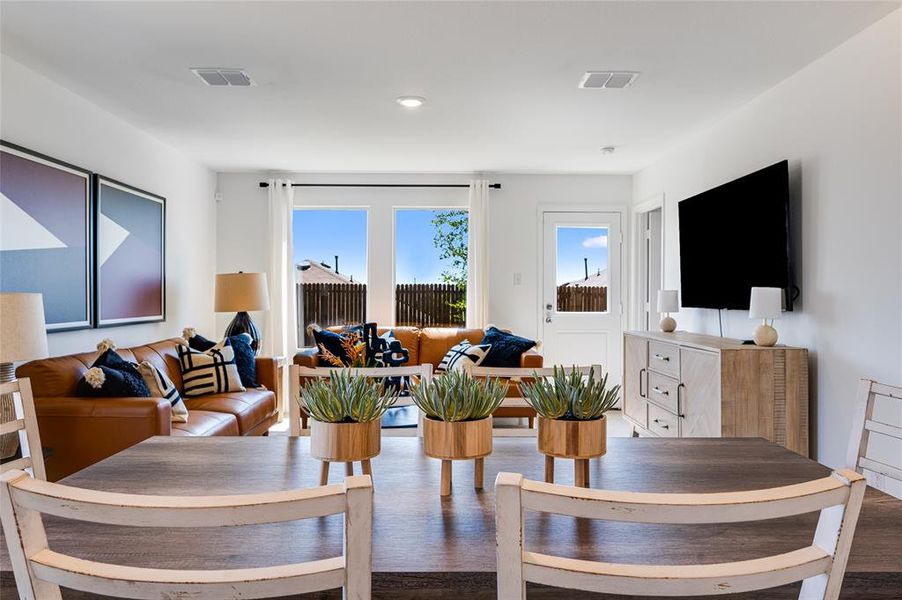 Dining space with hardwood / wood-style floors