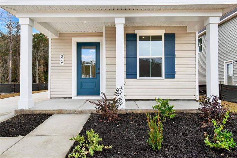 Exterior details and patio area of a home in Royal Oaks Cottages, Hardeeville (Image 2).