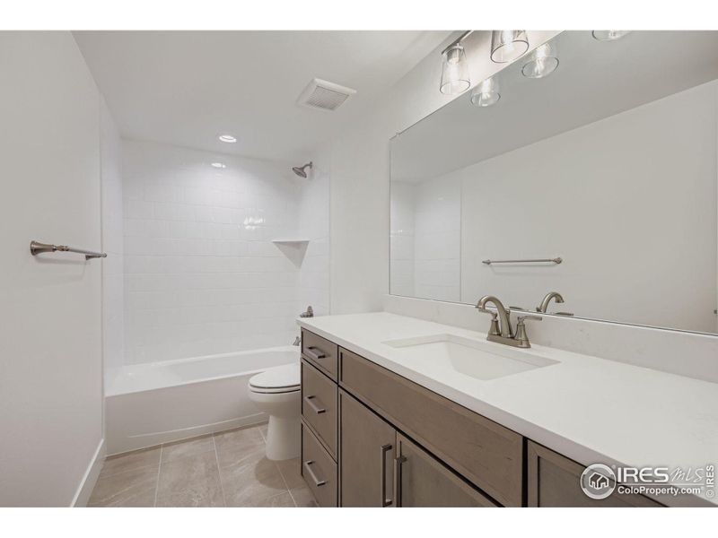 Furnished interior view inside a new home in RainDance - 60s, Windsor (Image 12).