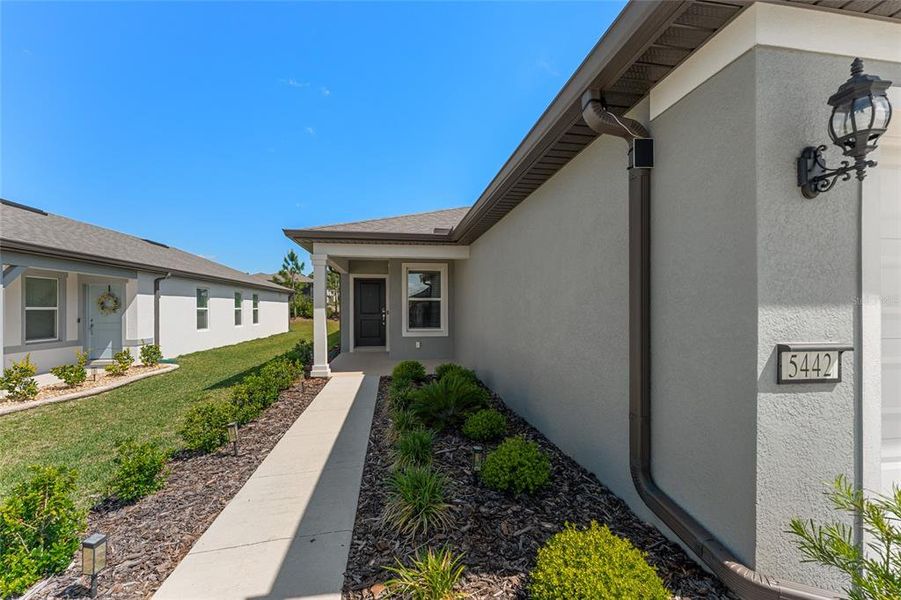Exterior details and patio area of a home in Del Webb Stone Creek, Ocala (Image 24).