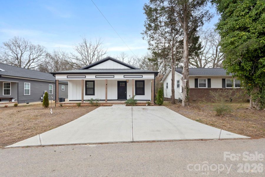 Front exterior of a new home in , Concord, NC, highlighting curb appeal (Image 22). Front exterior of a new home in , Concord, NC, highlighting curb appeal (Image 22).