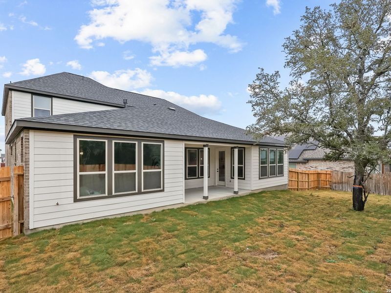Exterior details and patio area of a home in The Reserve at Potranco Oaks, Castroville (Image 3).