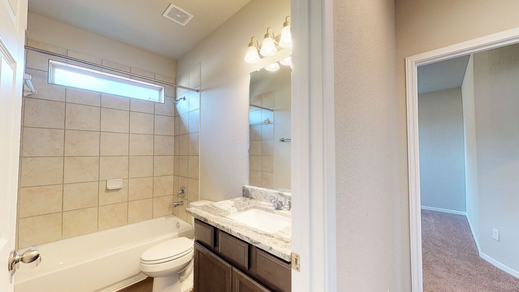 Representative furnished interior of a home built from the Floor Plan 3256 by Colina Homes in Grand Magnolia, Magnolia (Image 5).