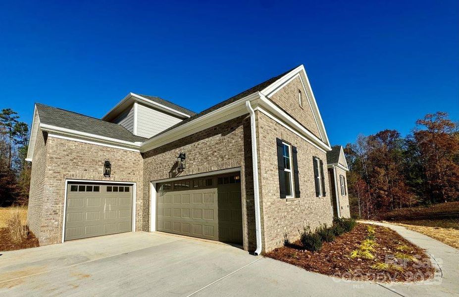 Front exterior of a new home in , Concord, NC, highlighting curb appeal (Image 21). Front exterior of a new home in , Concord, NC, highlighting curb appeal (Image 21).