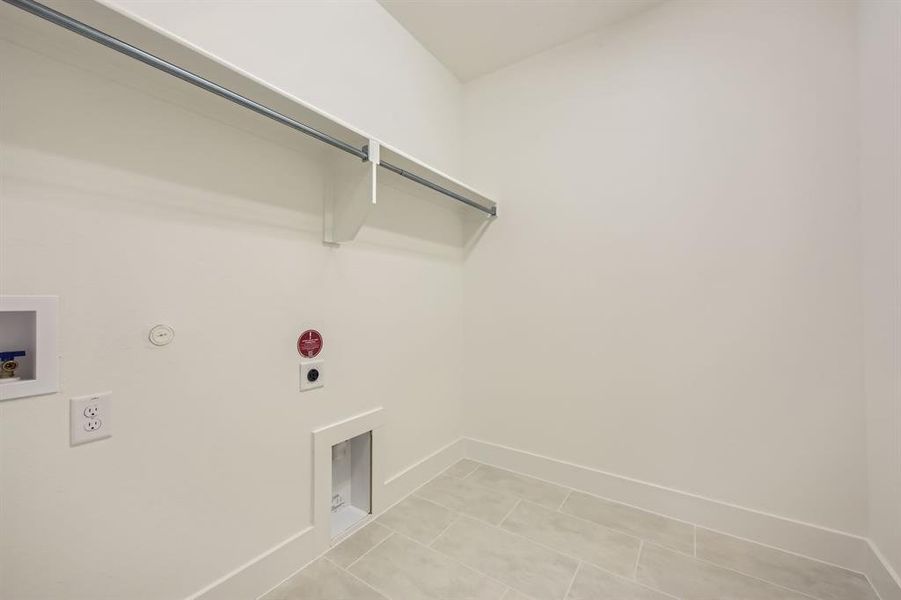 Laundry room featuring hookup for a washing machine, gas dryer hookup, and electric dryer hookup