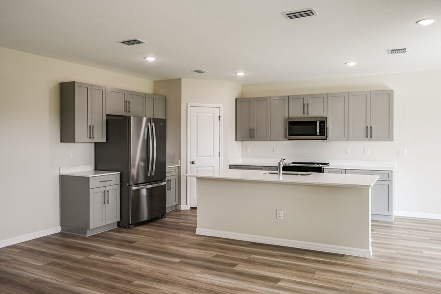Furnished interior view inside a new home in Pasadena Ridge, Dade City (Image 4).