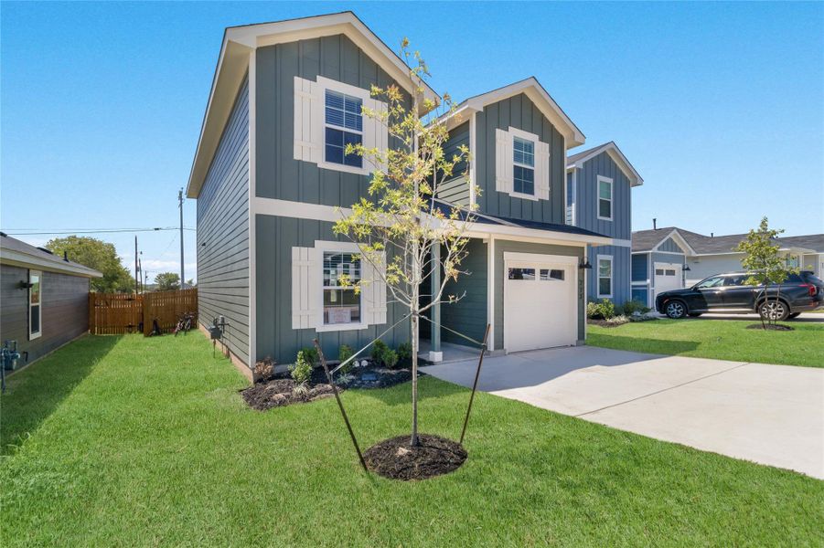 Front exterior of a new home in Marigold, Uhland, TX, highlighting curb appeal (Image 2).