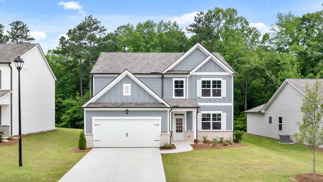 Front exterior of a new home in South Wind, Union City, GA, highlighting curb appeal (Image 1). Front exterior of a new home in South Wind, Union City, GA, highlighting curb appeal (Image 1).