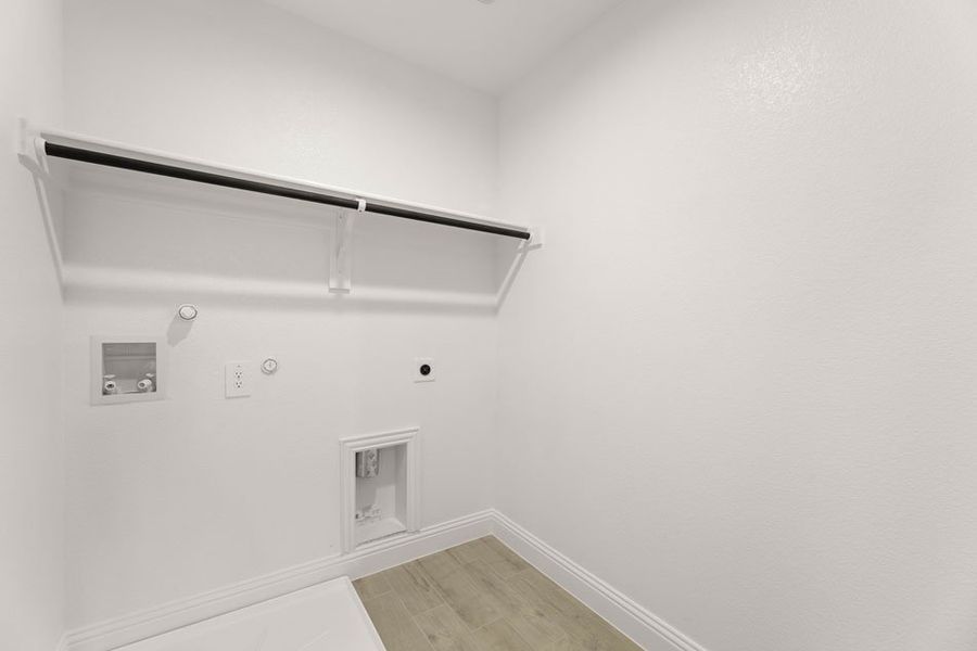 Front exterior of a new home in Main Street Village, Mansfield, TX, highlighting curb appeal (Image 26). Front exterior of a new home in Main Street Village, Mansfield, TX, highlighting curb appeal (Image 26).