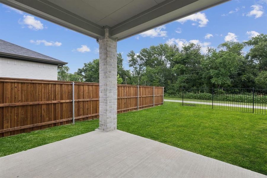 Covered Patio in the Picasso II home plan by Trophy Signature Homes – REPRESENTATIVE PHOTO