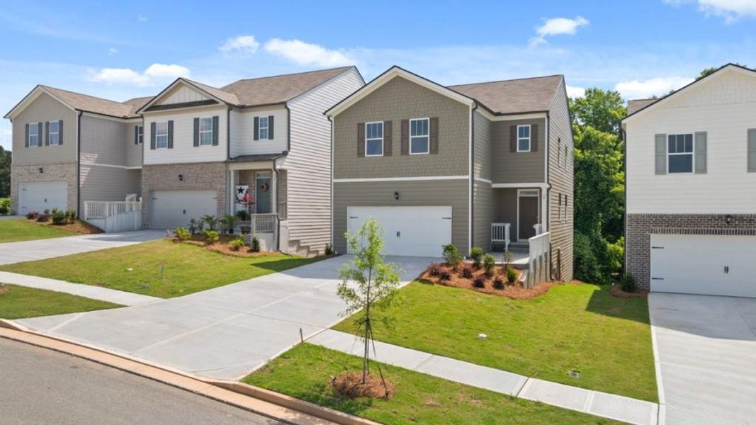 Front exterior of a new home in Rolling Meadows, Jasper, GA, highlighting curb appeal (Image 1). Front exterior of a new home in Rolling Meadows, Jasper, GA, highlighting curb appeal (Image 1).