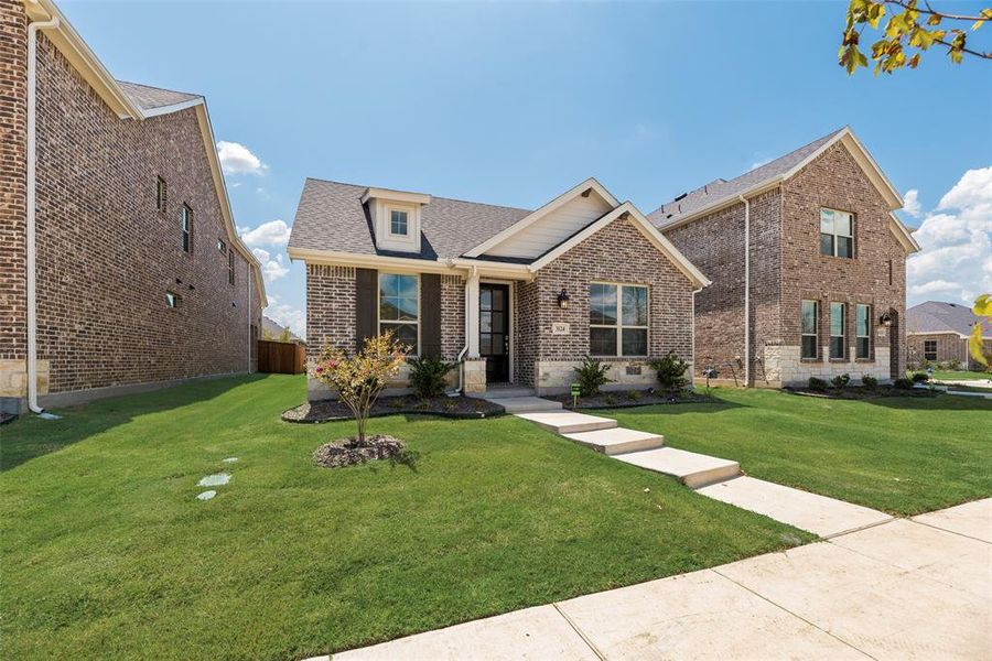 Front exterior of a home in the Arbors at Legacy Hills community, located in Celina, TX (Image 18).