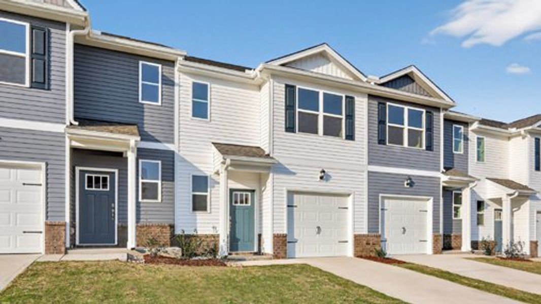 Front exterior of a new home in The Townes at Prestleigh, Wake Forest, NC, highlighting curb appeal (Image 2). Front exterior of a new home in The Townes at Prestleigh, Wake Forest, NC, highlighting curb appeal (Image 2).