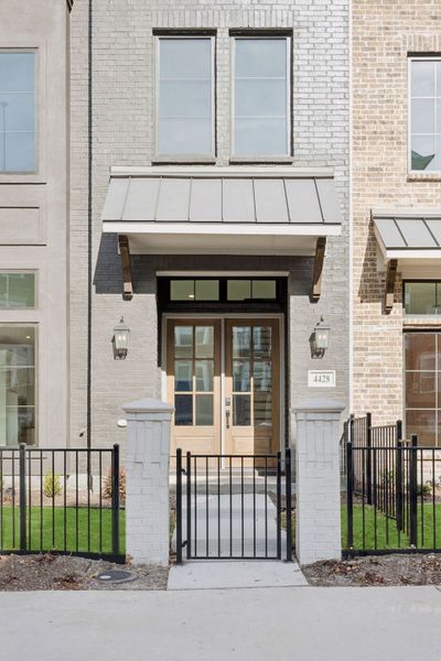 Exterior details and patio area of a home in Newman Village Townhomes, Frisco (Image 22).