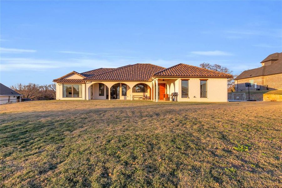 Rear view of house with yard