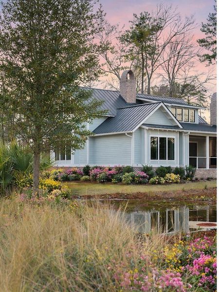 Front exterior of a new home in , Ravenel, SC, highlighting curb appeal (Image 7).