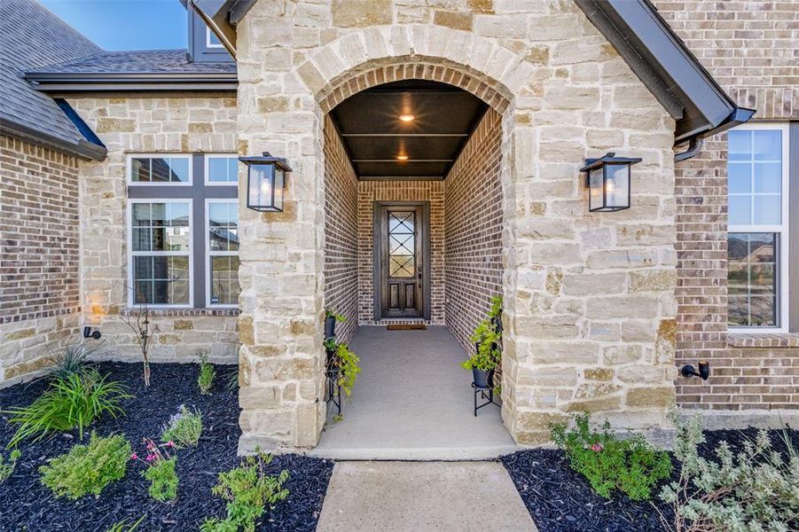 Exterior details and patio area of a home in Pecan Square - Estates, Northlake (Image 20).