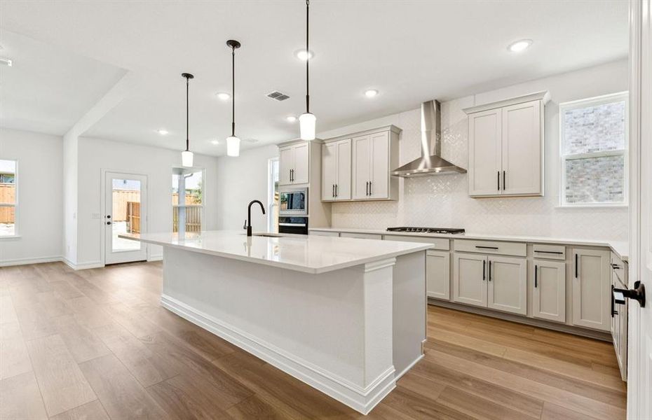 Spacious kitchen with eat-in bartop island