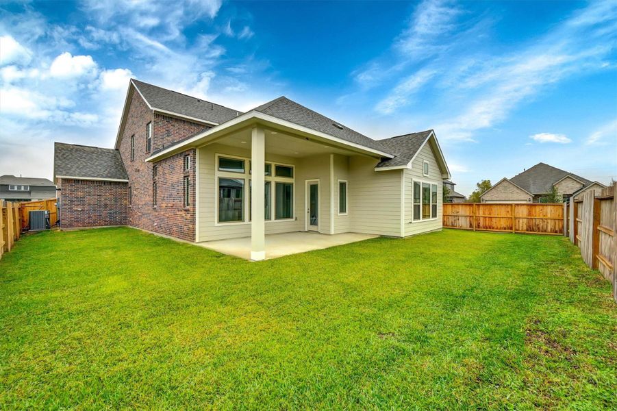 Exterior details and patio area of a home in Canterra Creek  60', Iowa Colony (Image 25).