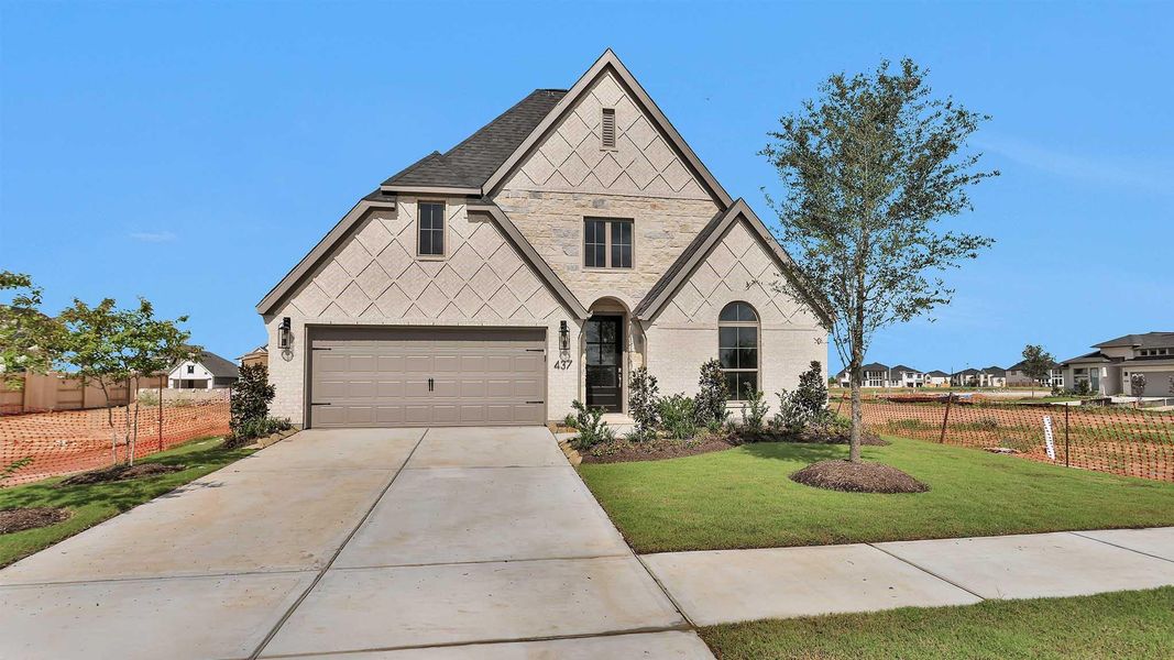 Front exterior of a new home in Grange 50', Katy, TX, highlighting curb appeal (Image 10).