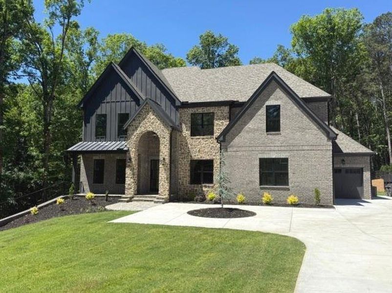Front exterior of a new home in , Lawrenceville, GA, highlighting curb appeal (Image 1). Front exterior of a new home in , Lawrenceville, GA, highlighting curb appeal (Image 1).