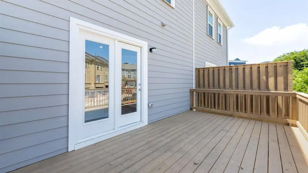 Exterior details and patio area of a home in Townes at Asbury, Hapeville (Image 3).