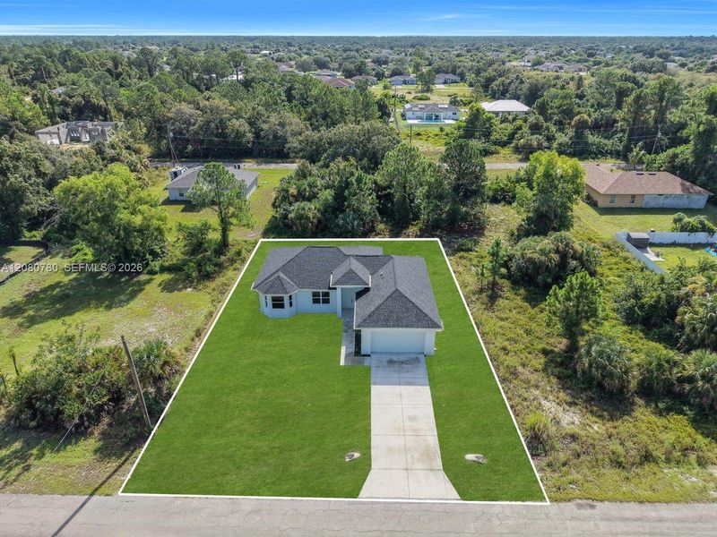Front exterior of a new home in , Lehigh Acres, FL, highlighting curb appeal (Image 19). Front exterior of a new home in , Lehigh Acres, FL, highlighting curb appeal (Image 19).