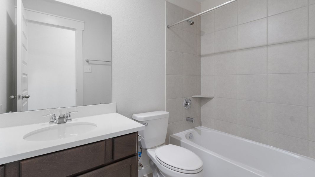 Representative furnished interior of a home built from the Blanton by Brightland Homes in Sunterra, Katy (Image 10).