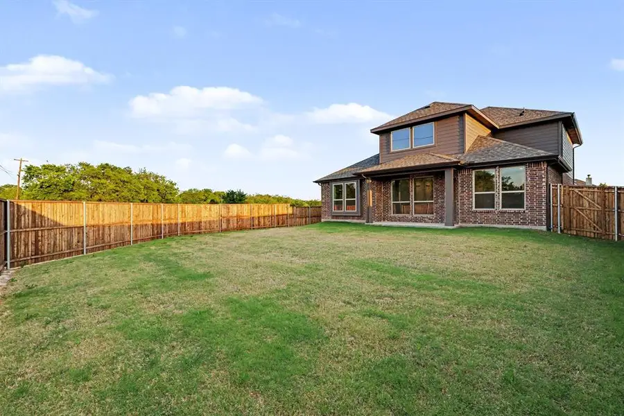 Exterior details and patio area of a home in Courts Of Bonnie Brae, Denton (Image 3).
