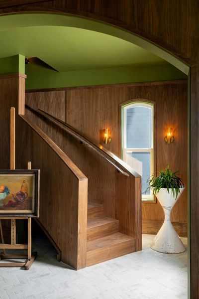 The staircase itself looks like an art piece. Made of out of walnut, the curved stairs gives a very grand but sleek entry to the home.
