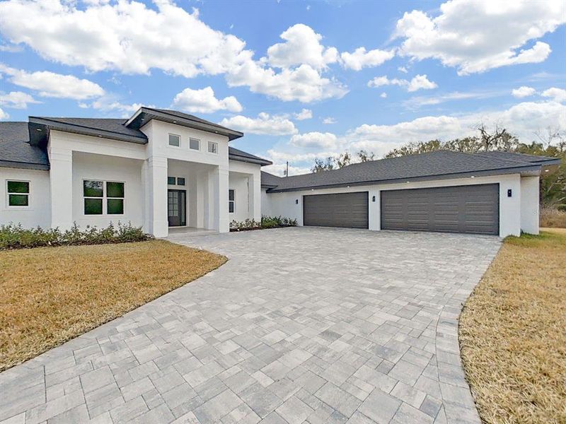 Front exterior of a new home in , Lutz, FL, highlighting curb appeal (Image 26). Front exterior of a new home in , Lutz, FL, highlighting curb appeal (Image 26).