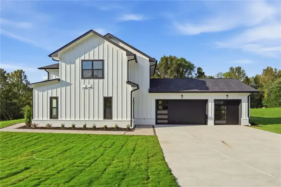 Front exterior of a new home in , Cumming, GA, highlighting curb appeal (Image 28).