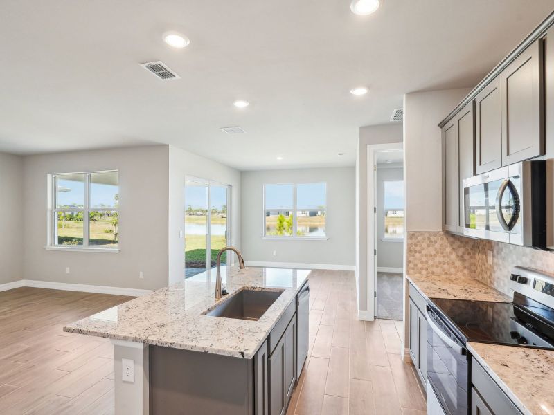 Furnished interior view inside a new home in Crescent Lakes - Reserve Series, Punta Gorda (Image 9).
