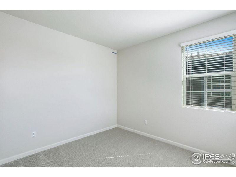 Spacious, unfurnished interior of a new home in Westside Crossing Townhomes, Berthoud (Image 27).
